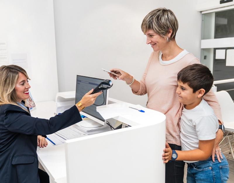 Mother visiting a healthcare center with her son.